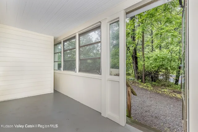 a view of a room that has a window in it