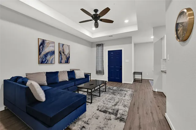 a living room with furniture and a rug