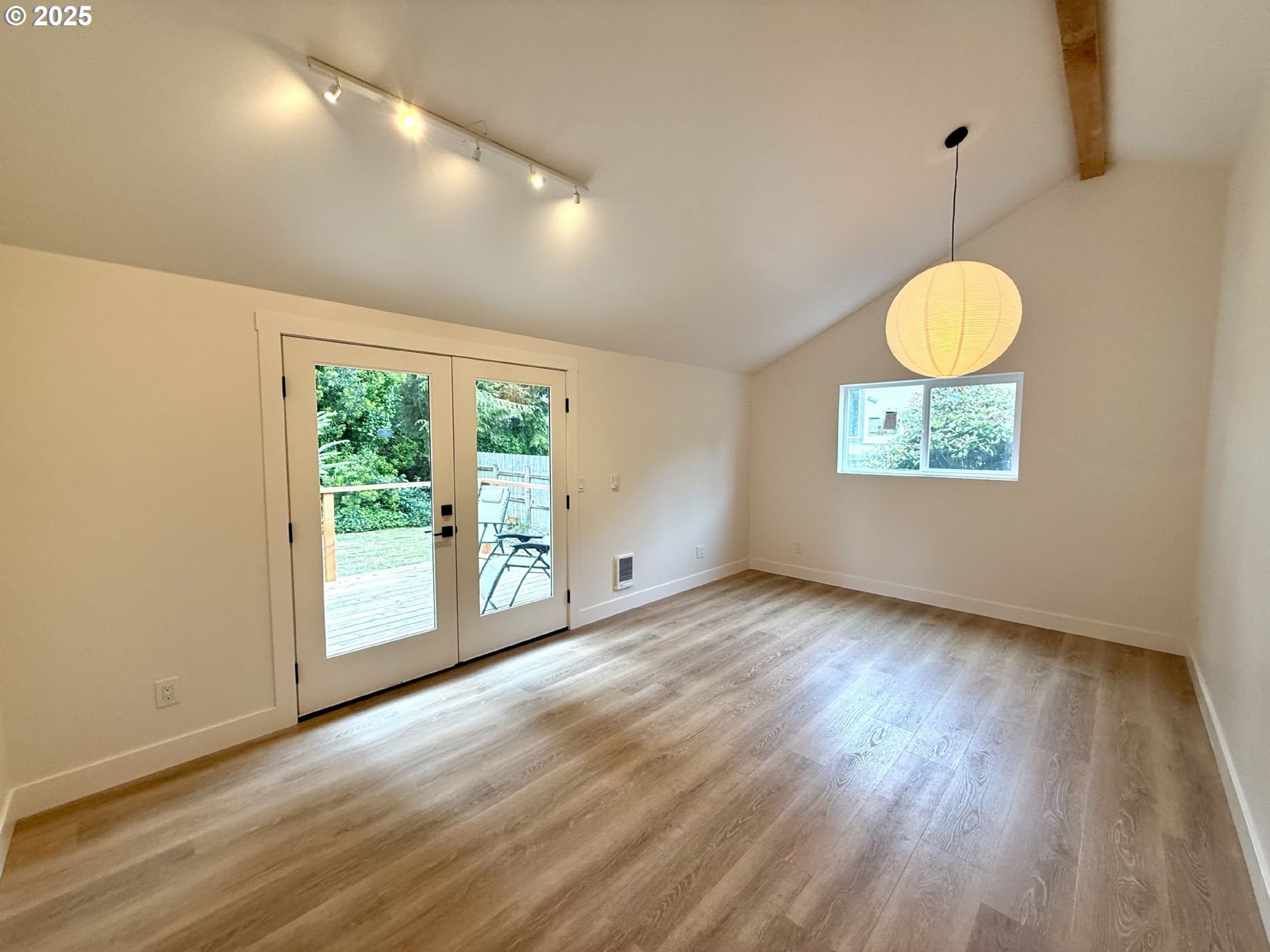 63534 South Olive Road Coos Bay, OR 97420 - Photo 13 of 20 a view of an empty room with a window and wooden floor
