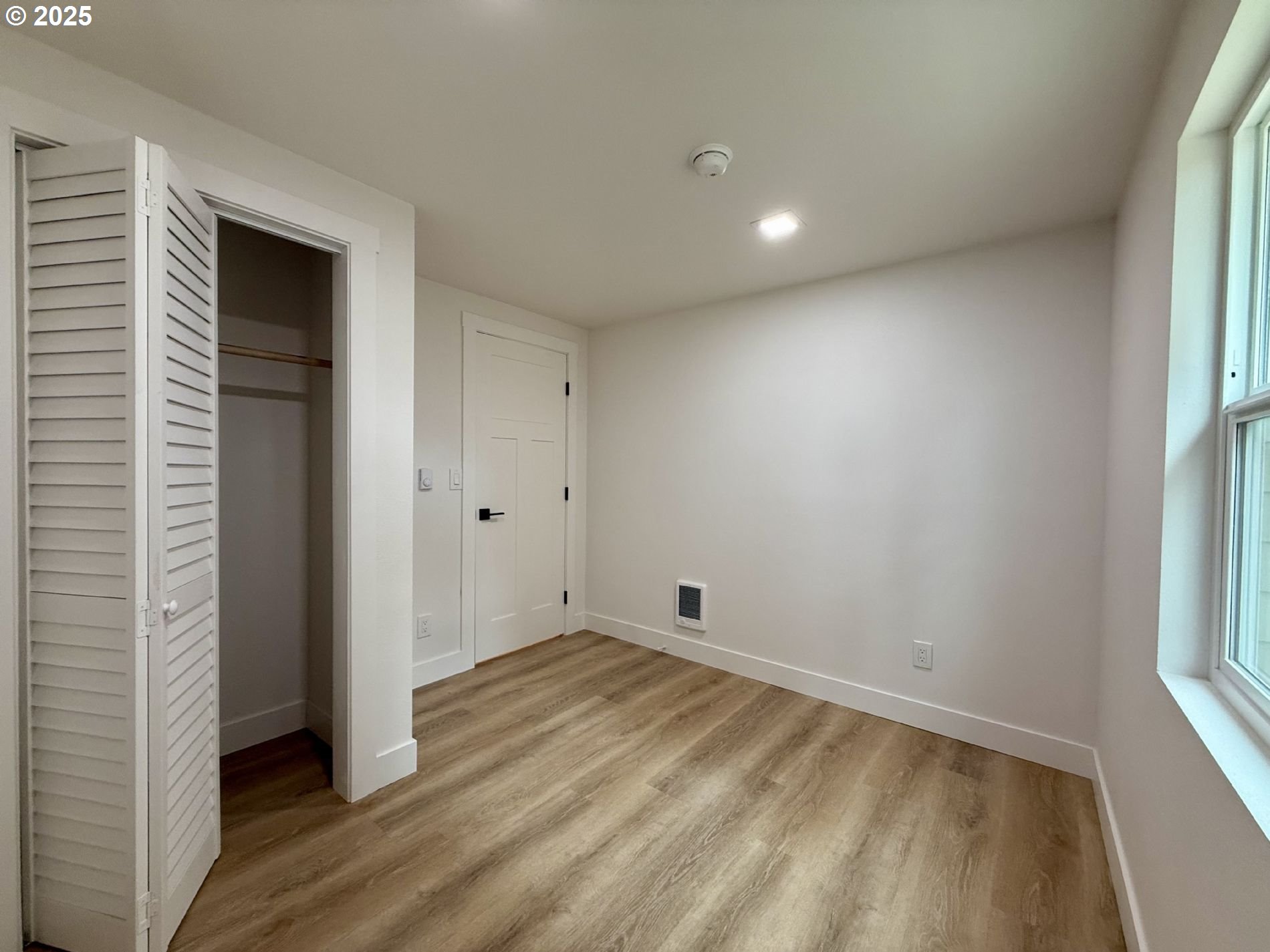 63534 South Olive Road Coos Bay, OR 97420 - Photo 10 of 20 an empty room with wooden floor and windows