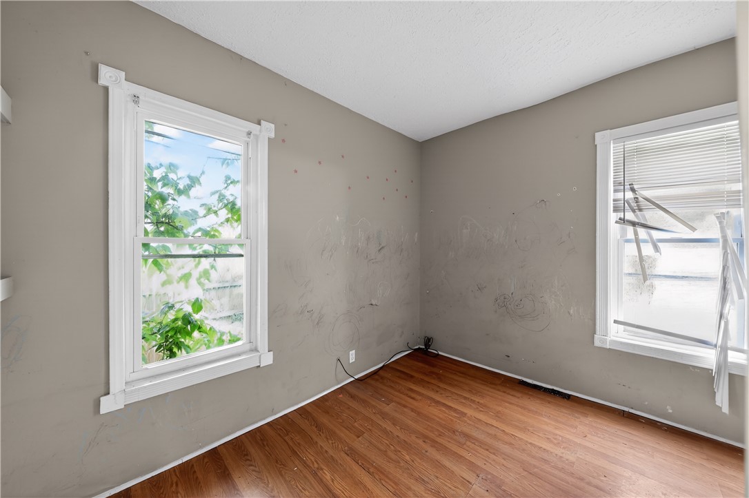 205 Rita Street Dayton, OH 45404 - Photo 17 of 34 This bright room features durable hardwood flooring and large windows, ready for a personal touch.