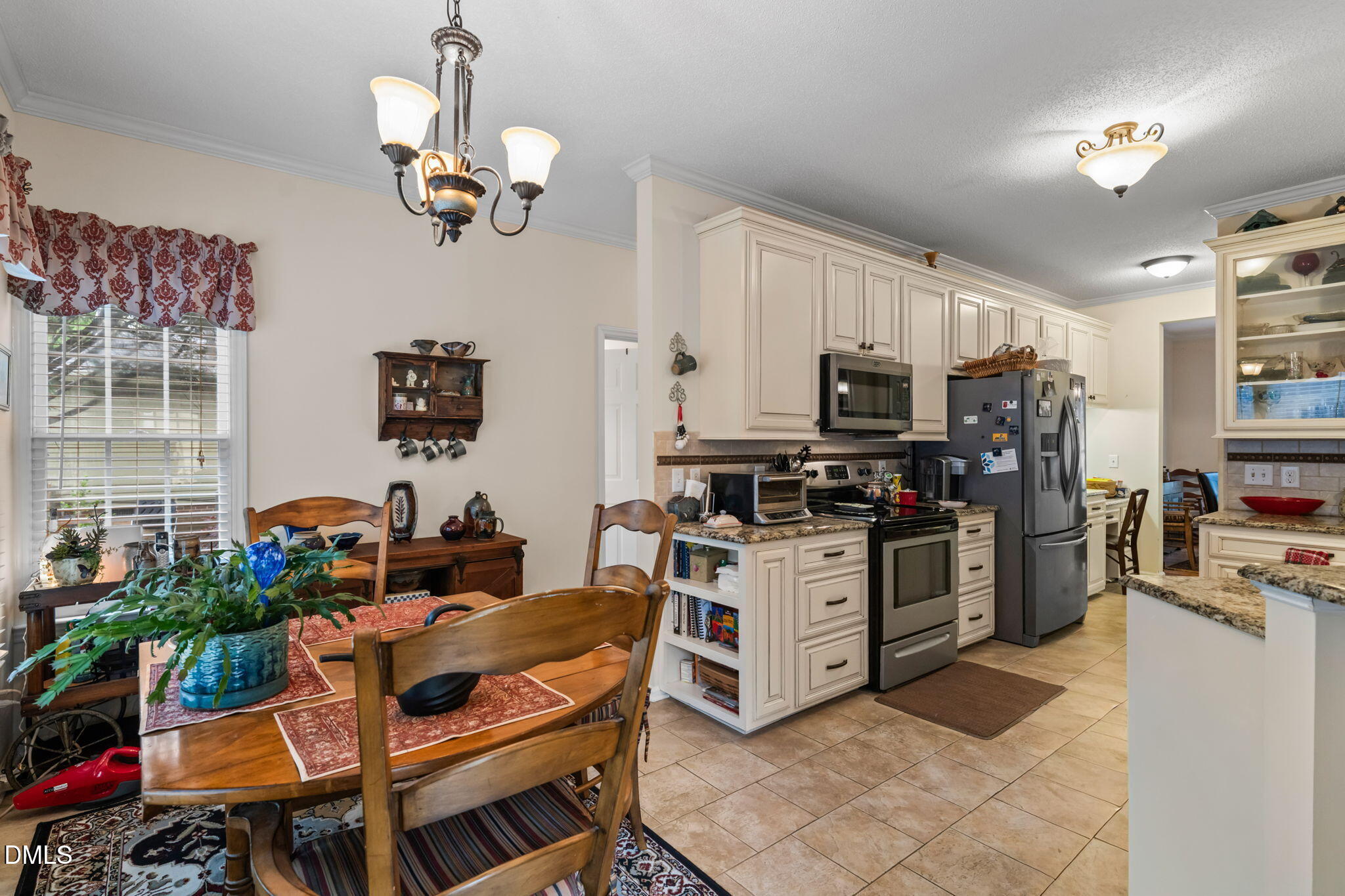 9104 Deerland Grove Drive Raleigh, NC 27615 - Photo 12 of 42 Breakfast Room into Kichen