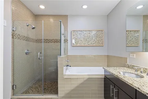 a view of walk in closet with clothes