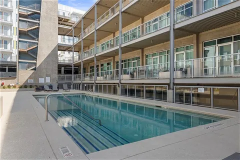 a view of swimming pool with outdoor seating