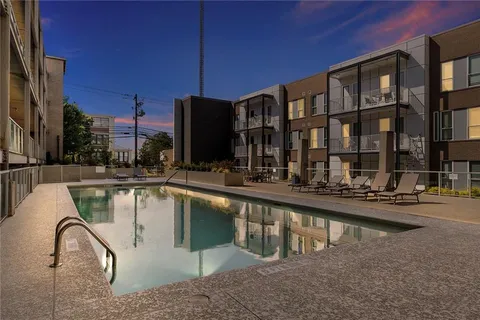 a view of swimming pool from a balcony