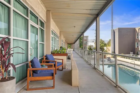a lobby with furniture and floor to ceiling window
