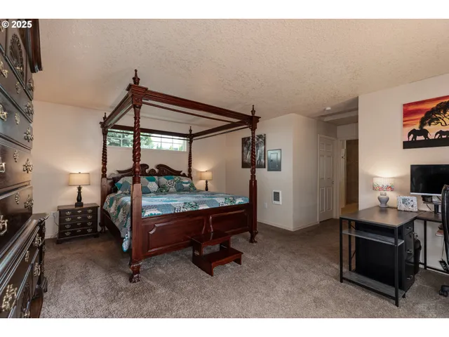 a bedroom with furniture and a window