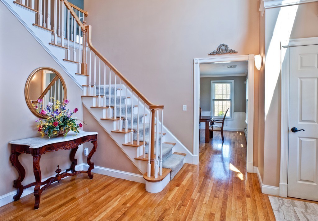 79 Linden Lane Hanover, MA 02339 - Photo 12 of 30 a view of entryway dining room and hall with wooden floor