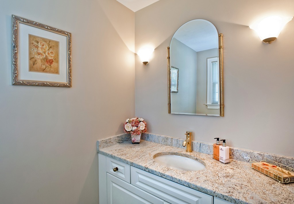 79 Linden Lane Hanover, MA 02339 - Photo 13 of 30 a bathroom with a granite countertop sink and a mirror