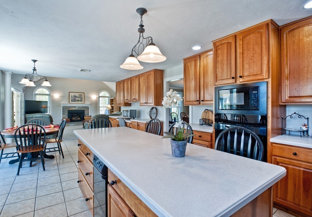 79 Linden Lane Hanover, MA 02339 - Photo 4 of 30 a large kitchen with a table and chairs