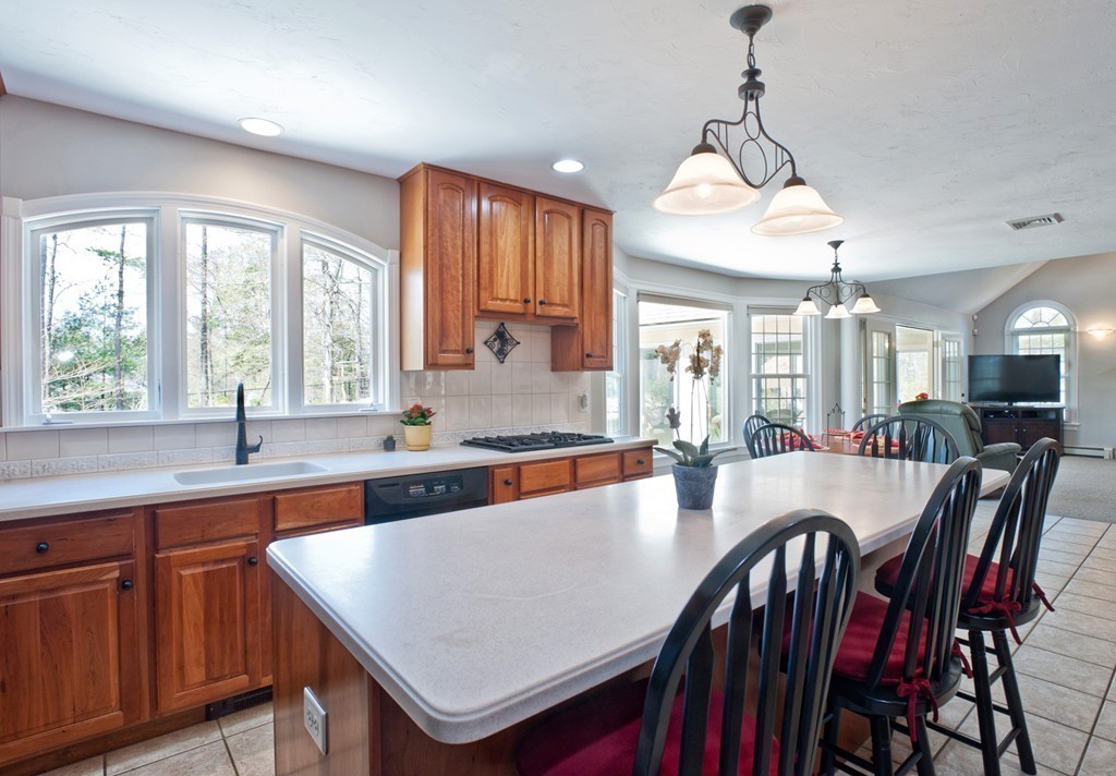 79 Linden Lane Hanover, MA 02339 - Photo 6 of 30 a large kitchen with a table and chairs