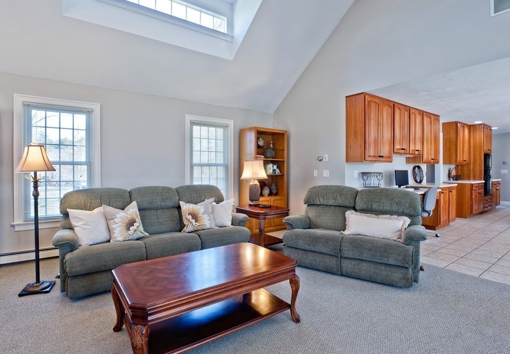 79 Linden Lane Hanover, MA 02339 - Photo 8 of 30 a living room with furniture and a large window