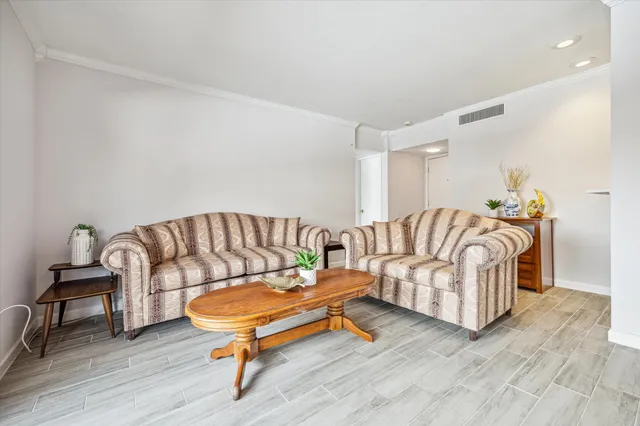 a living room with furniture and a rug