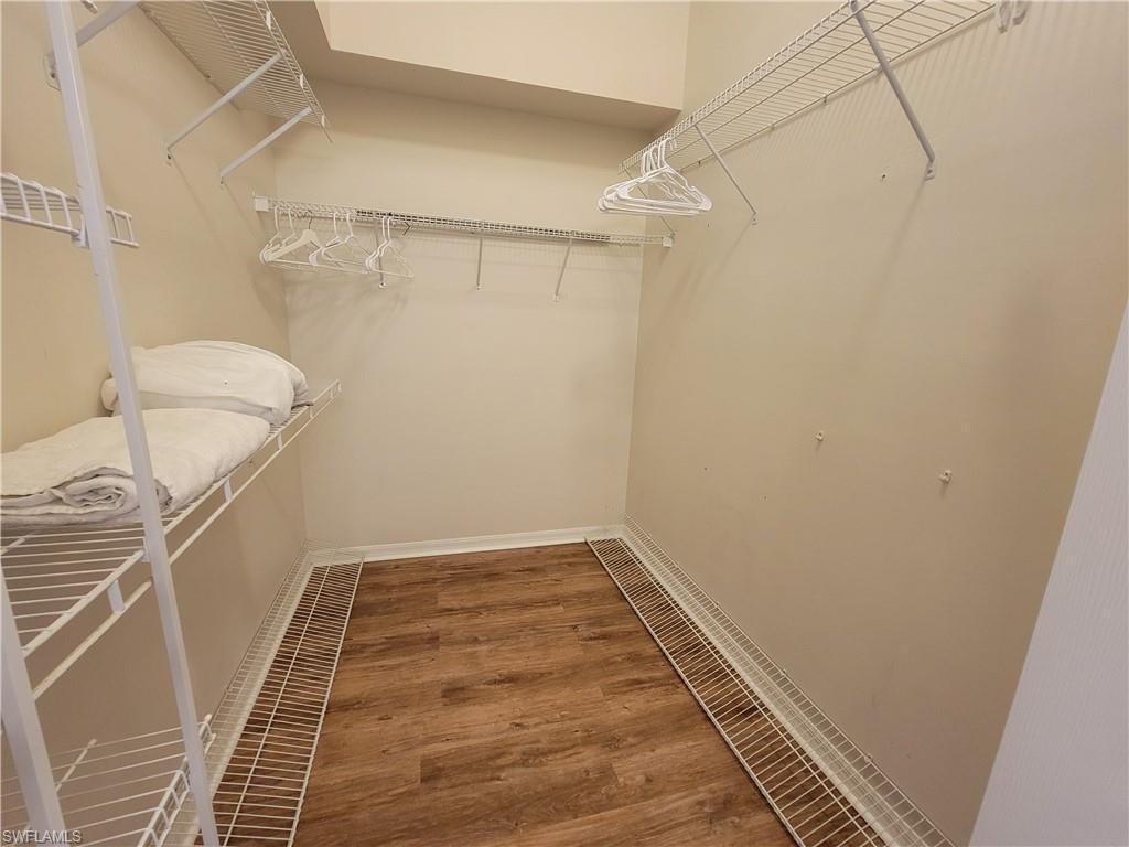 4950 Deerfield Way, Unit D202 Naples, FL 34110 - Photo 15 of 21 a bathroom with a sink and a shower