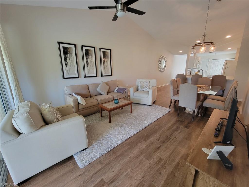 4950 Deerfield Way, Unit D202 Naples, FL 34110 - Photo 5 of 21 a living room with furniture