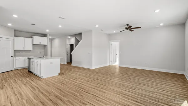 a view of kitchen with wooden floor and window
