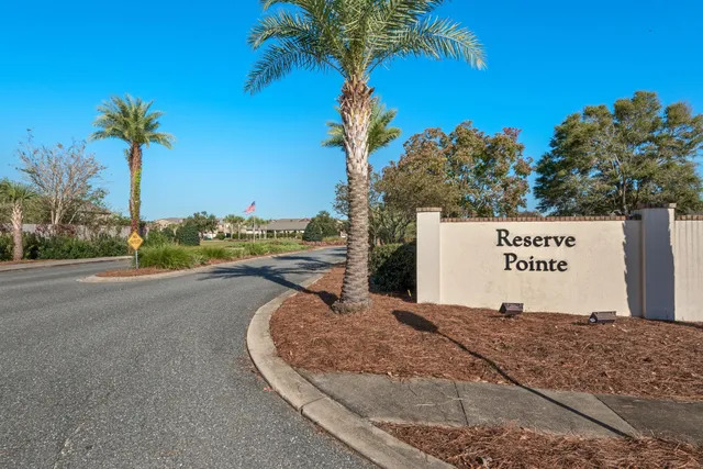 a sign board with a park bench