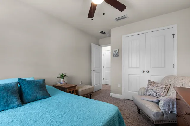 a bedroom with bed and furniture