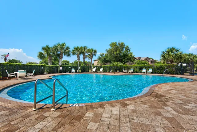 a view of swimming pool with seating space