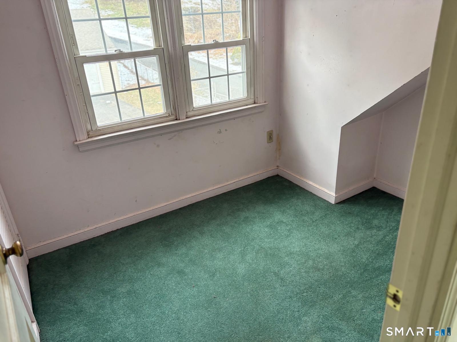 329 Bronson Road Fairfield, CT 06890 - Photo 2 of 23 an empty room with a window