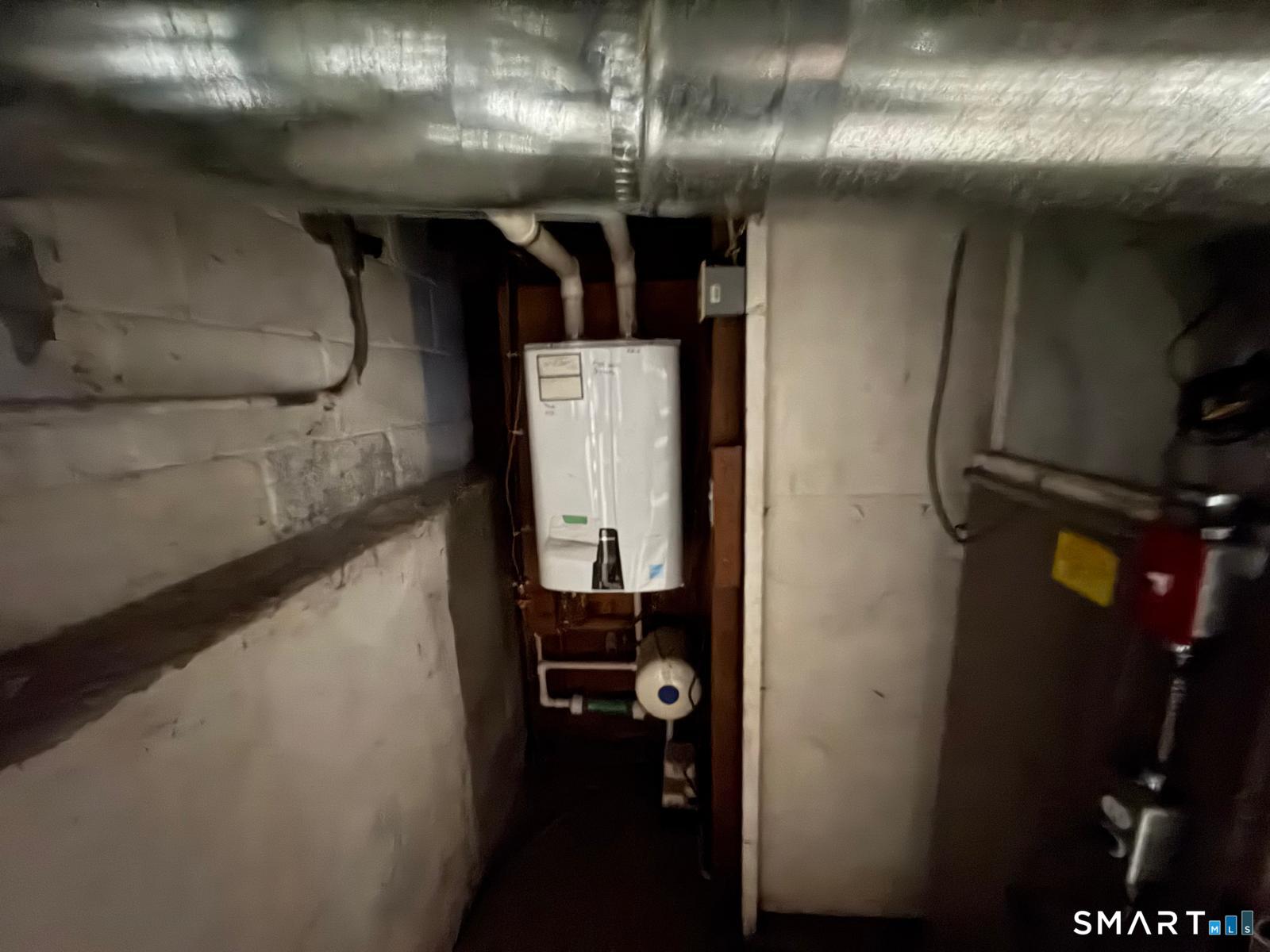 329 Bronson Road Fairfield, CT 06890 - Photo 6 of 23 a close view of water heater room