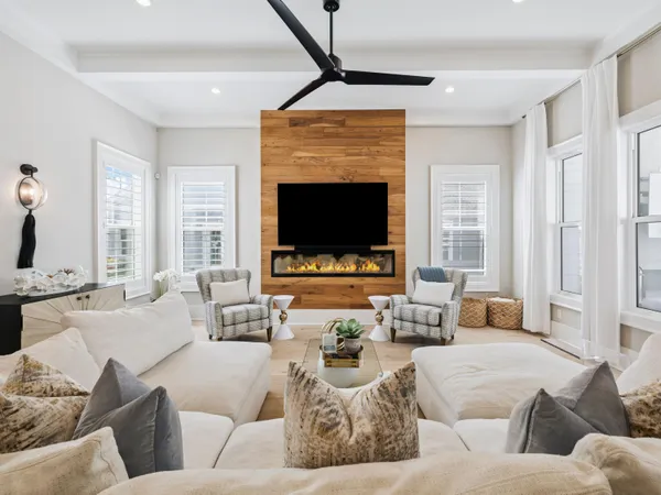 a living room with furniture flat screen tv and a fireplace