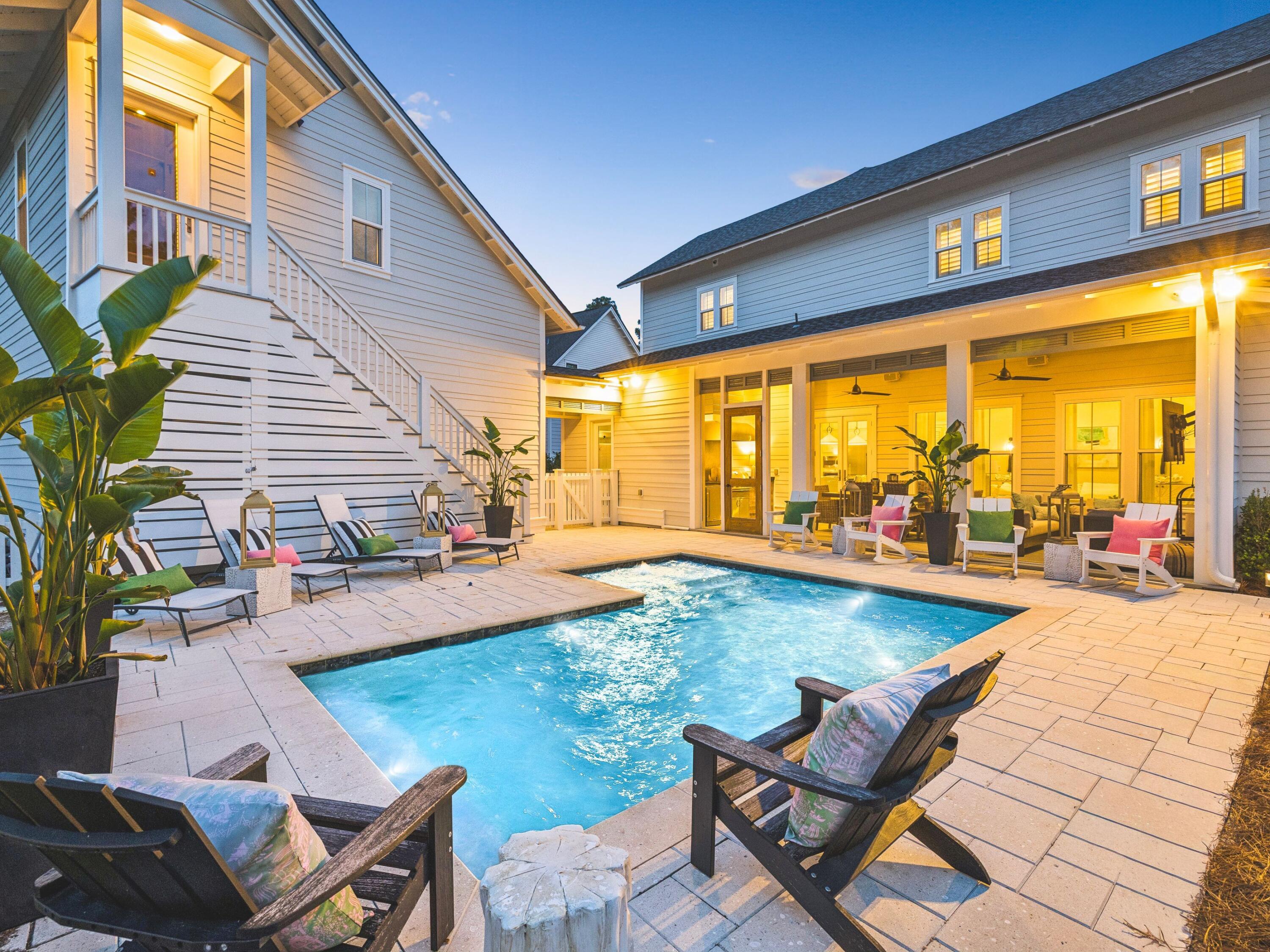 85 Trailhead Drive Watersound, FL 32461 - Photo 2 of 48 a view of a swimming pool with chairs in patio