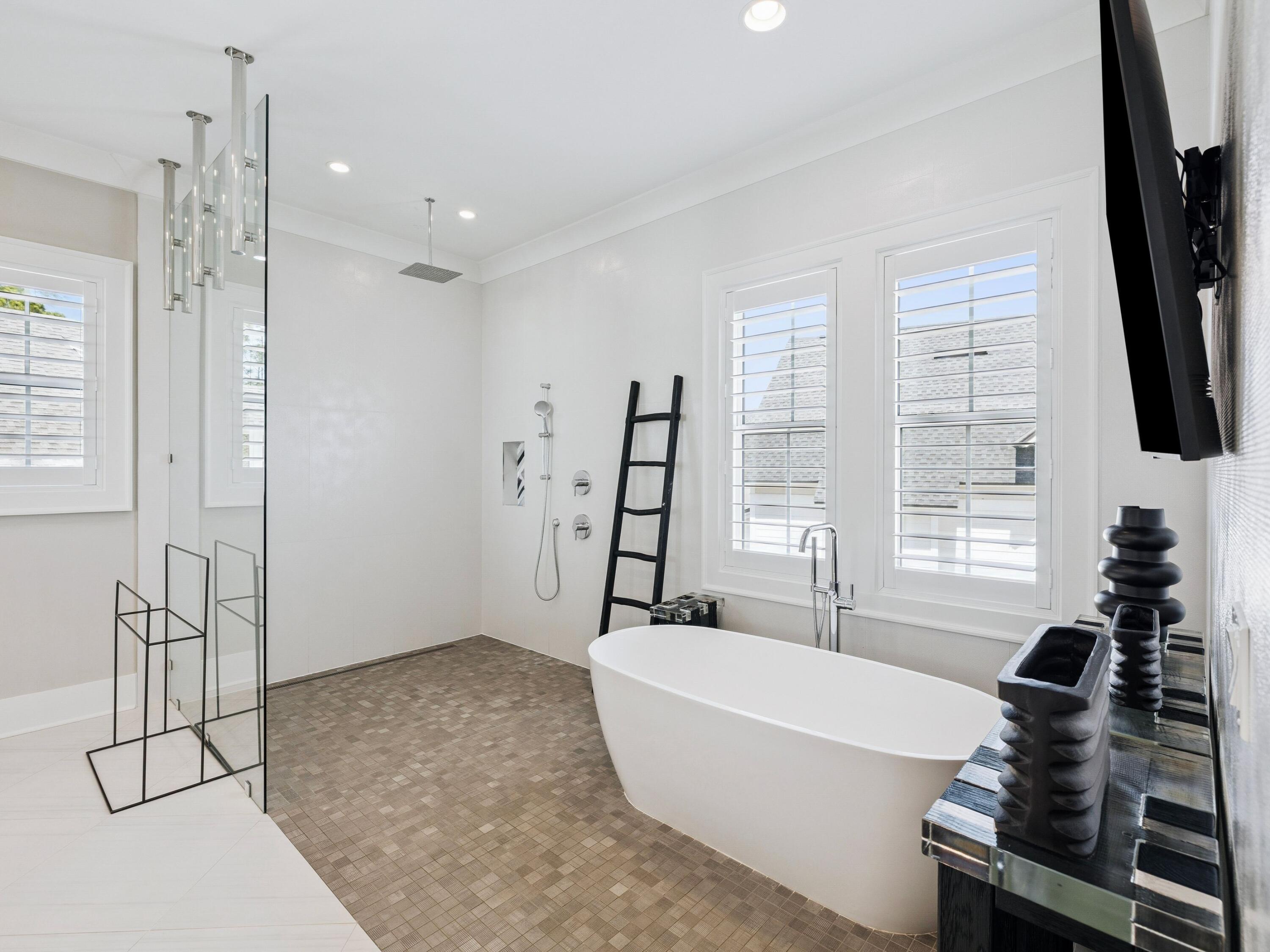 85 Trailhead Drive Watersound, FL 32461 - Photo 24 of 48 a bathroom with a bathtub and a flat screen tv