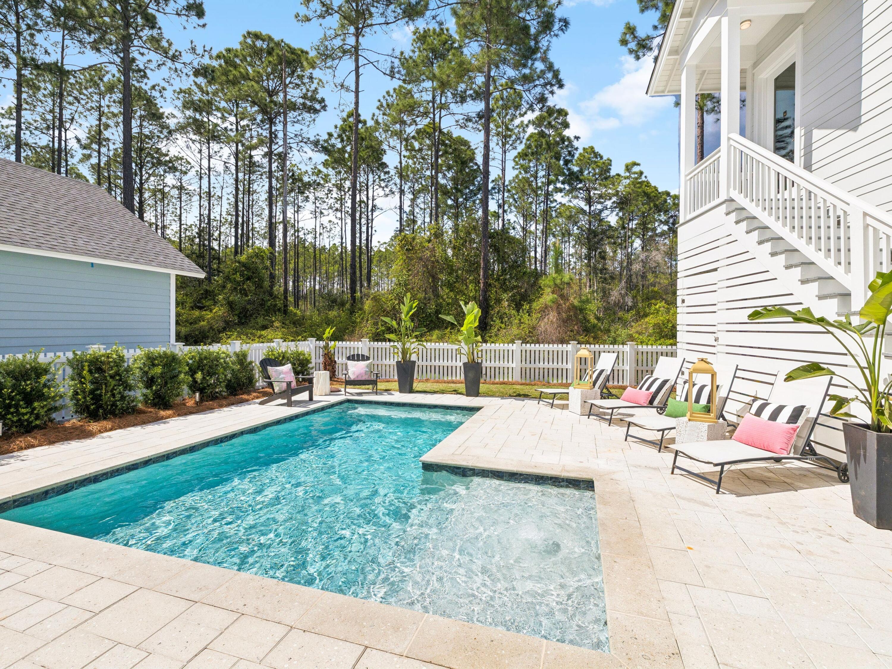 85 Trailhead Drive Watersound, FL 32461 - Photo 35 of 48 a view of a backyard with sitting area