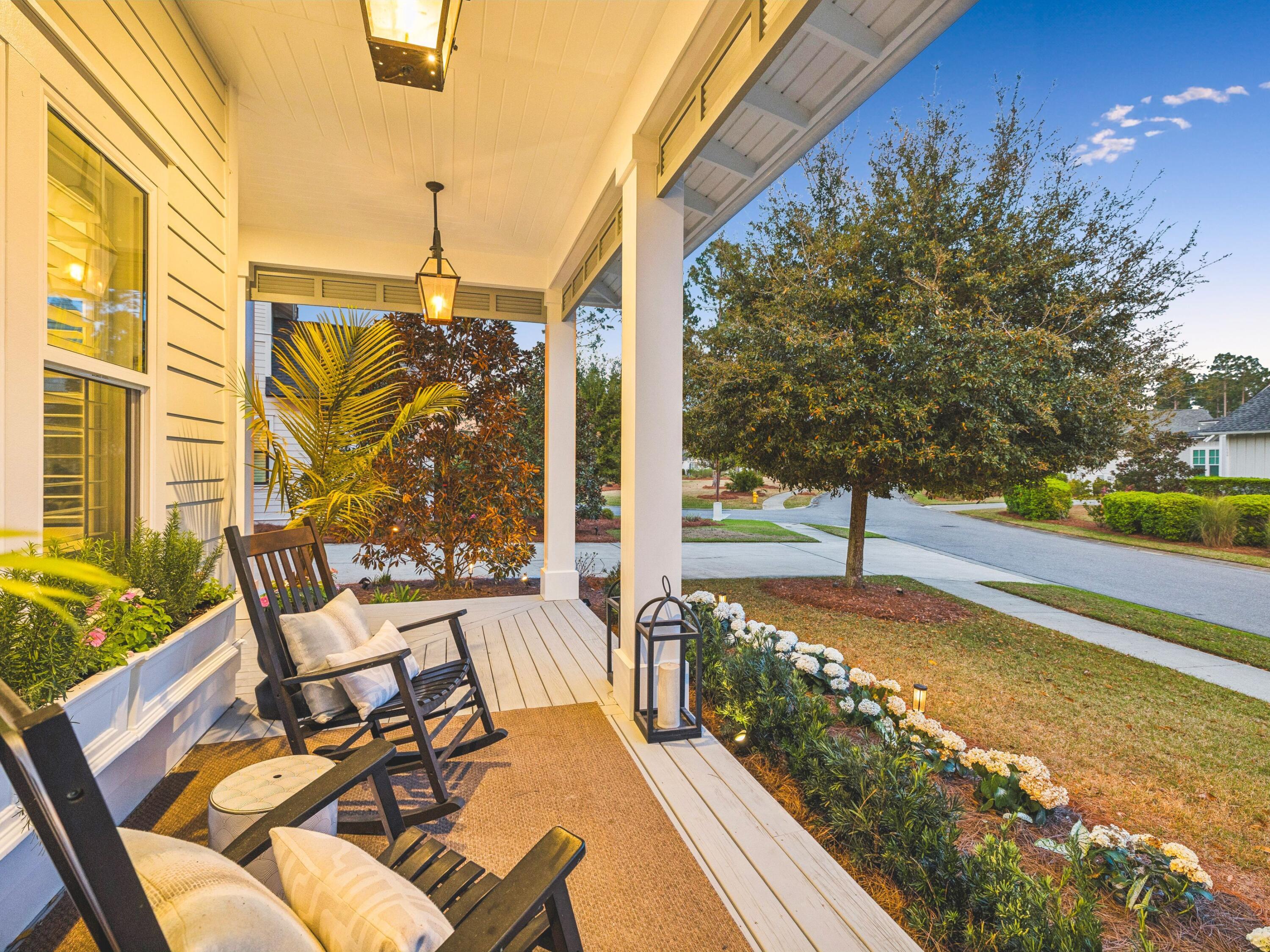 85 Trailhead Drive Watersound, FL 32461 - Photo 40 of 48 a view of a balcony with two chairs and a table