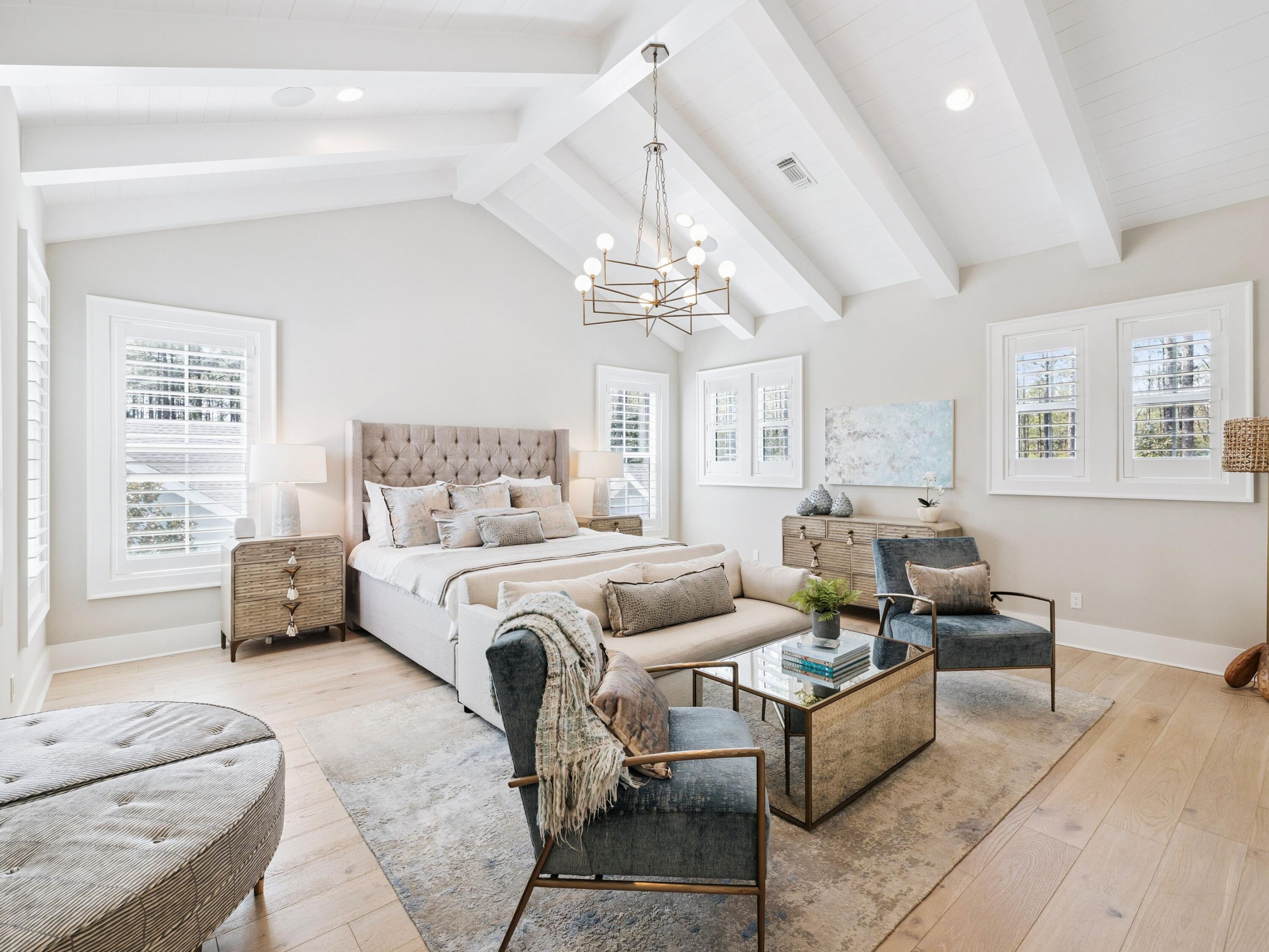 85 Trailhead Drive Watersound, FL 32461 - Photo 5 of 48 a bedroom with furniture and a chandelier