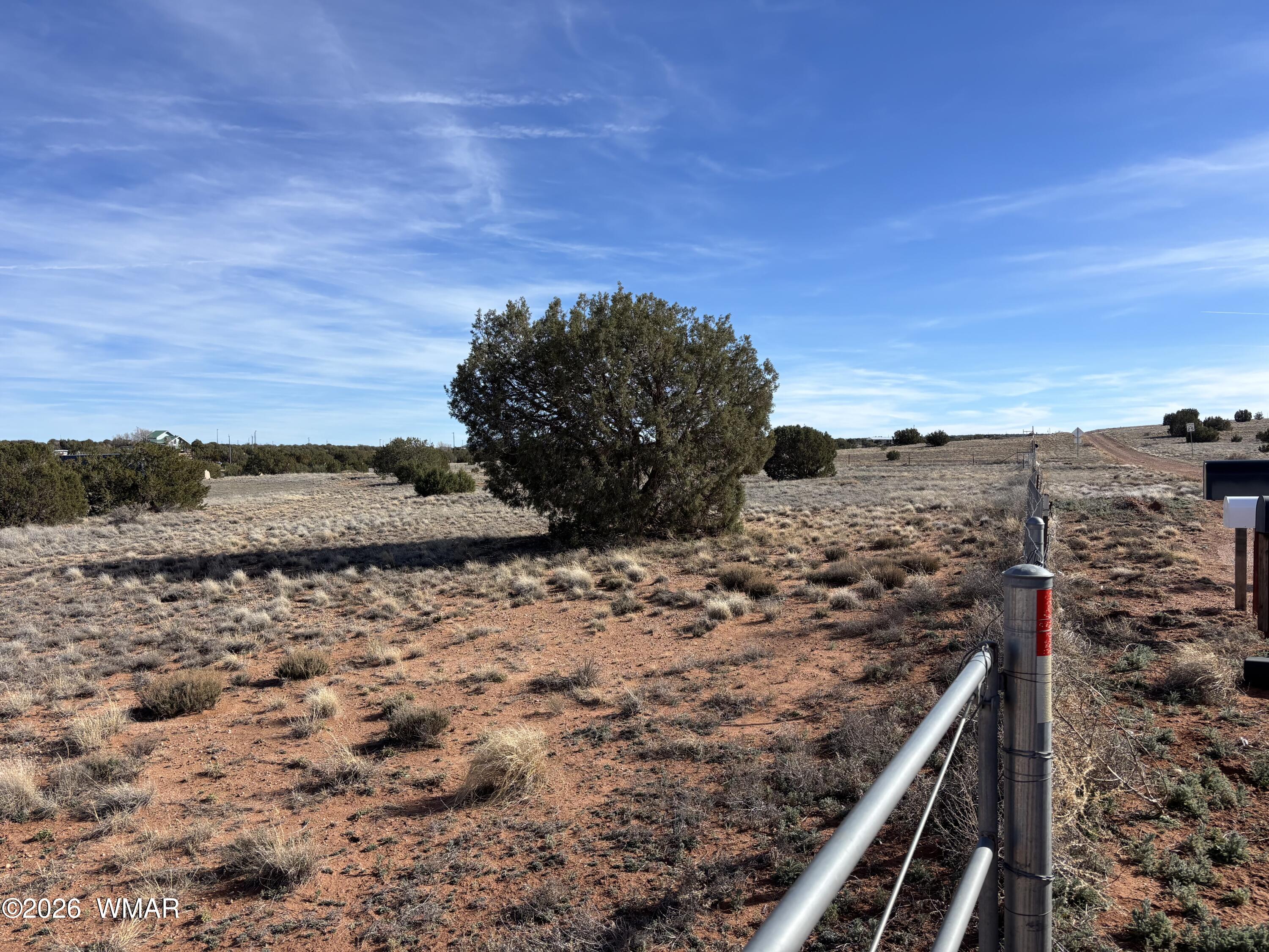 4533 Appaloosa Road Snowflake, AZ 85937 - Photo 2 of 7 a view of a dry yard with wooden fence