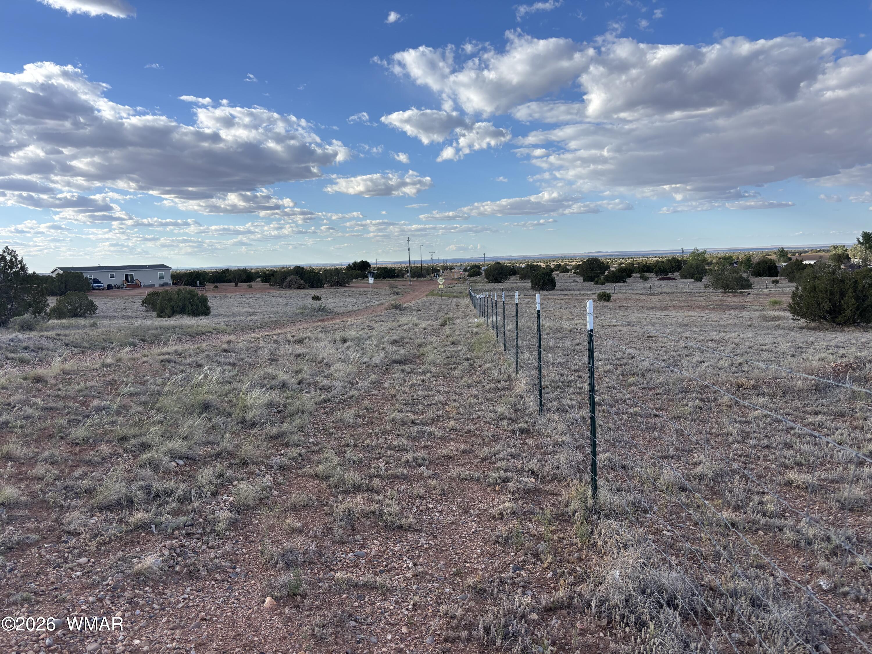 4533 Appaloosa Road Snowflake, AZ 85937 - Photo 7 of 7 a view of a lake with a yard