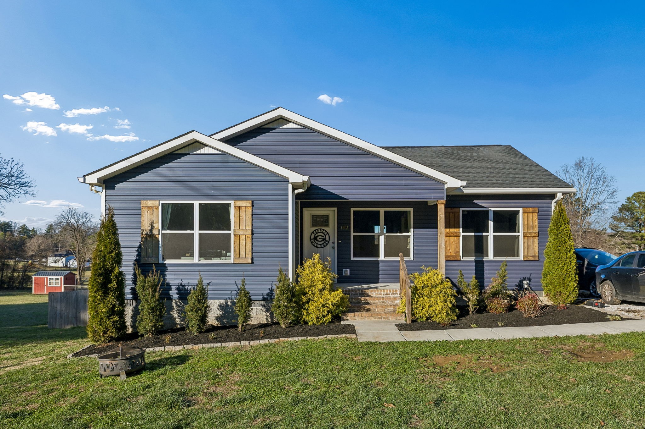 a front view of a house with a yard