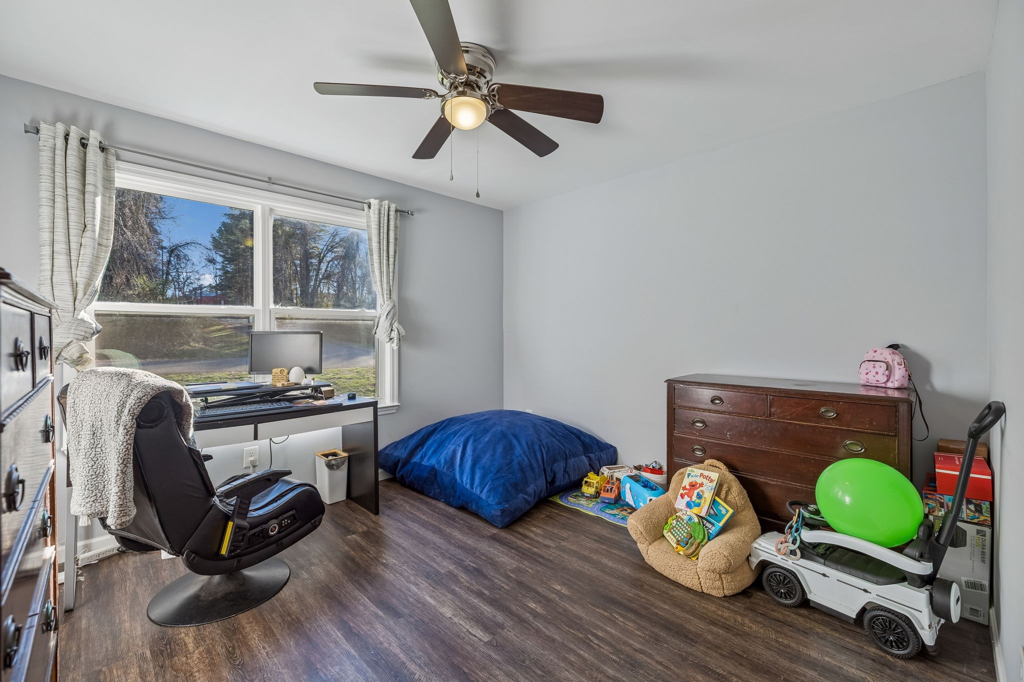 142 Pine Avenue Morrison, TN 37357 - Photo 14 of 29 a bedroom with furniture and a wooden floor