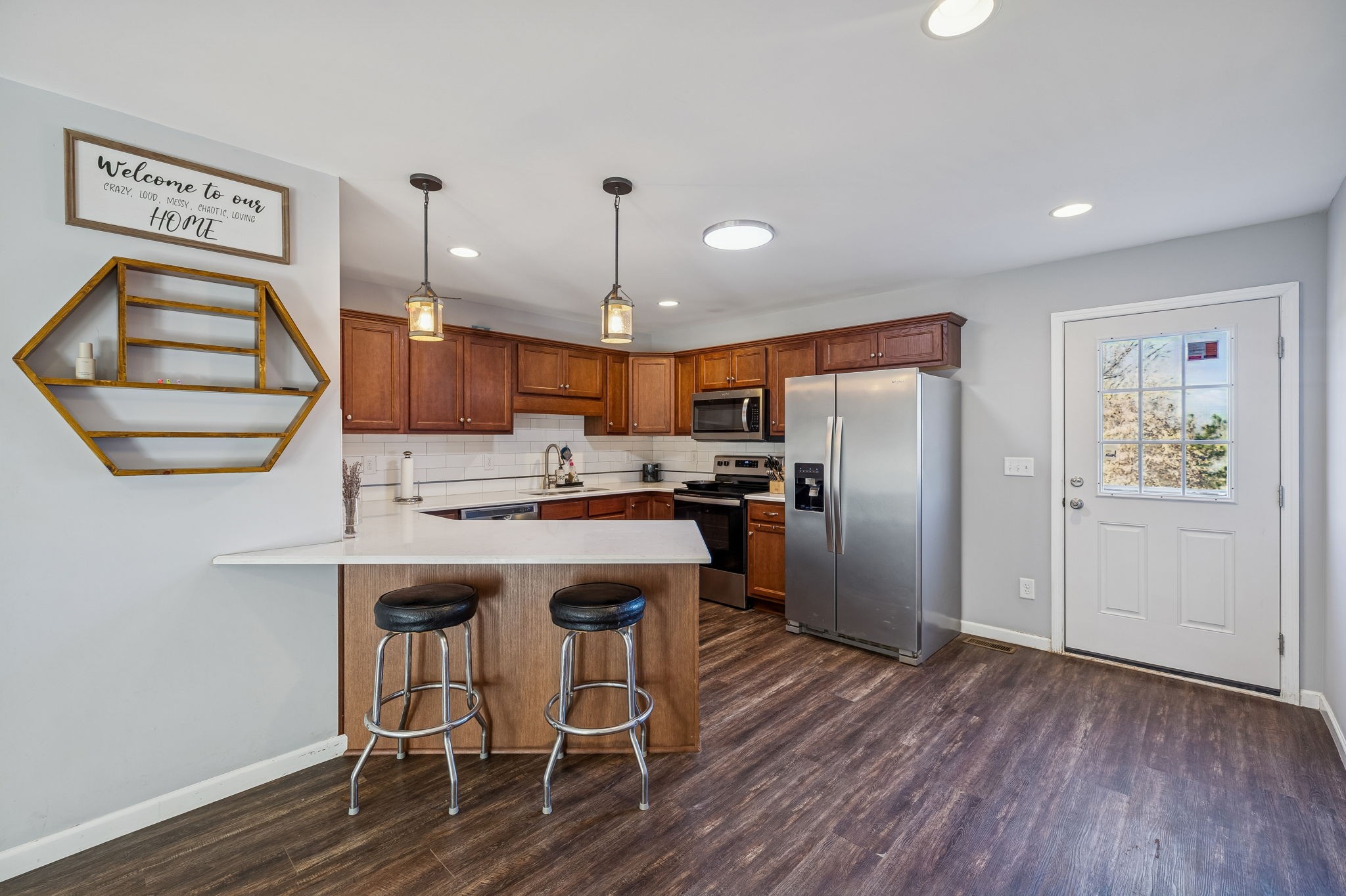 142 Pine Avenue Morrison, TN 37357 - Photo 6 of 29 a kitchen with a refrigerator a sink and cabinets