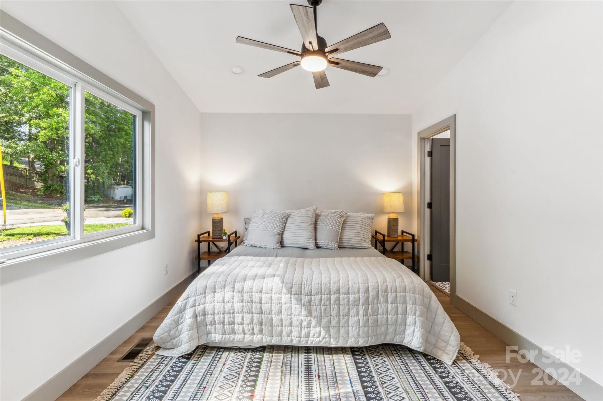 151 Laurel Loop Asheville, NC 28806 - Photo 15 of 35 a bedroom with a bed and a window