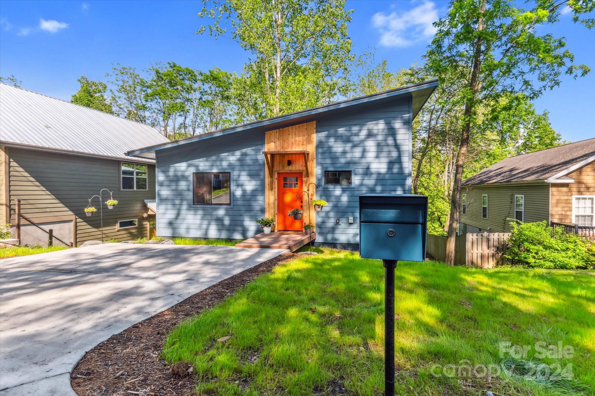 151 Laurel Loop Asheville, NC 28806 - Photo 2 of 35 a view of a backyard with a garden and plants