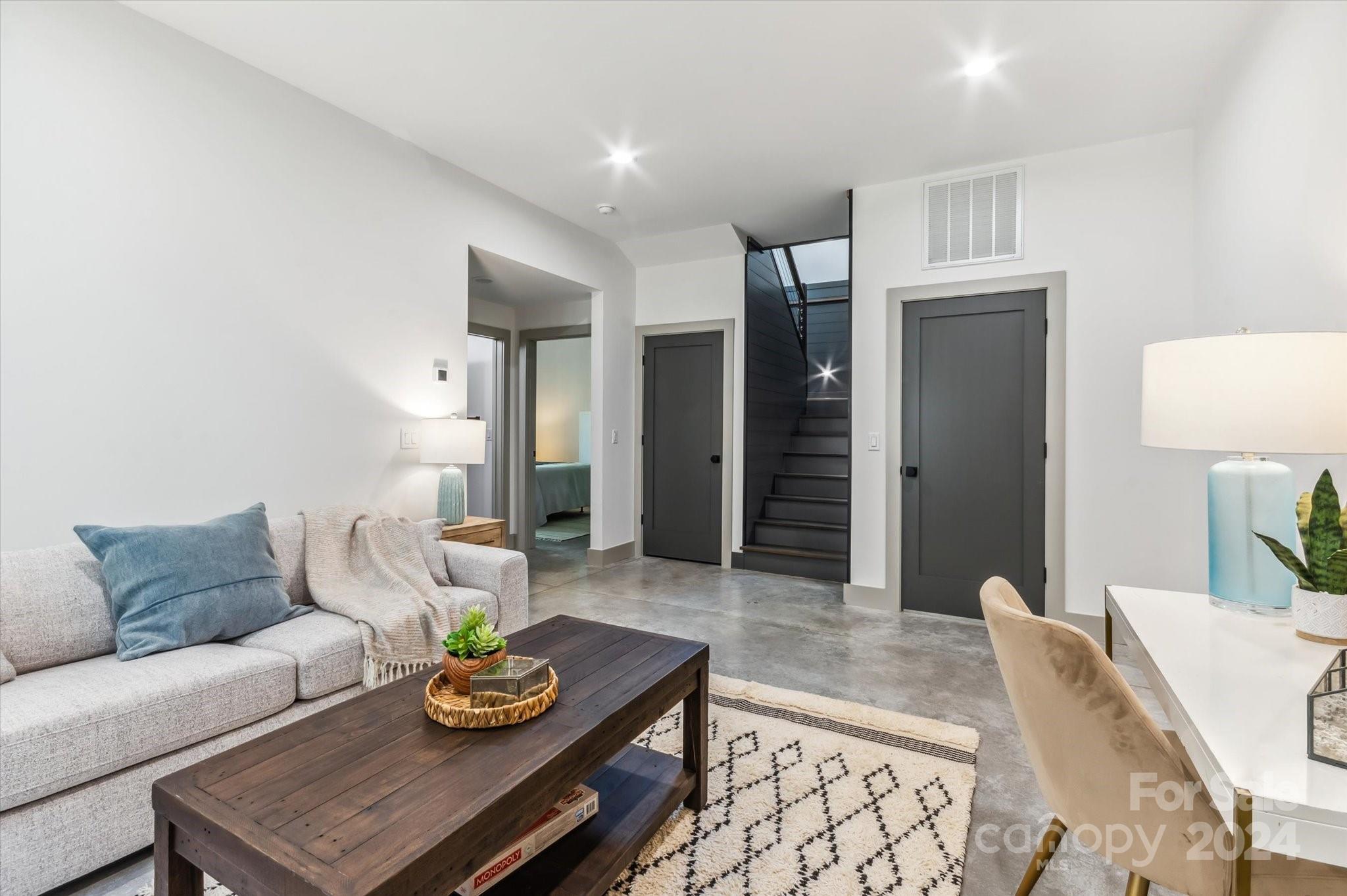151 Laurel Loop Asheville, NC 28806 - Photo 23 of 35 a living room with furniture and a rug