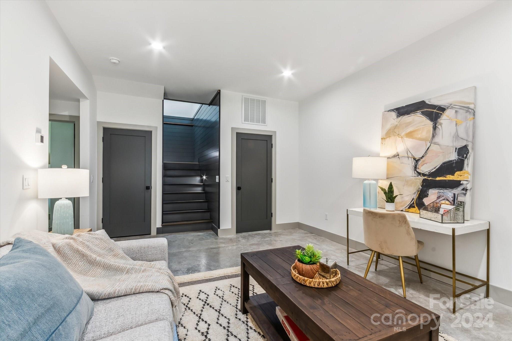 151 Laurel Loop Asheville, NC 28806 - Photo 24 of 35 a living room with furniture and a table