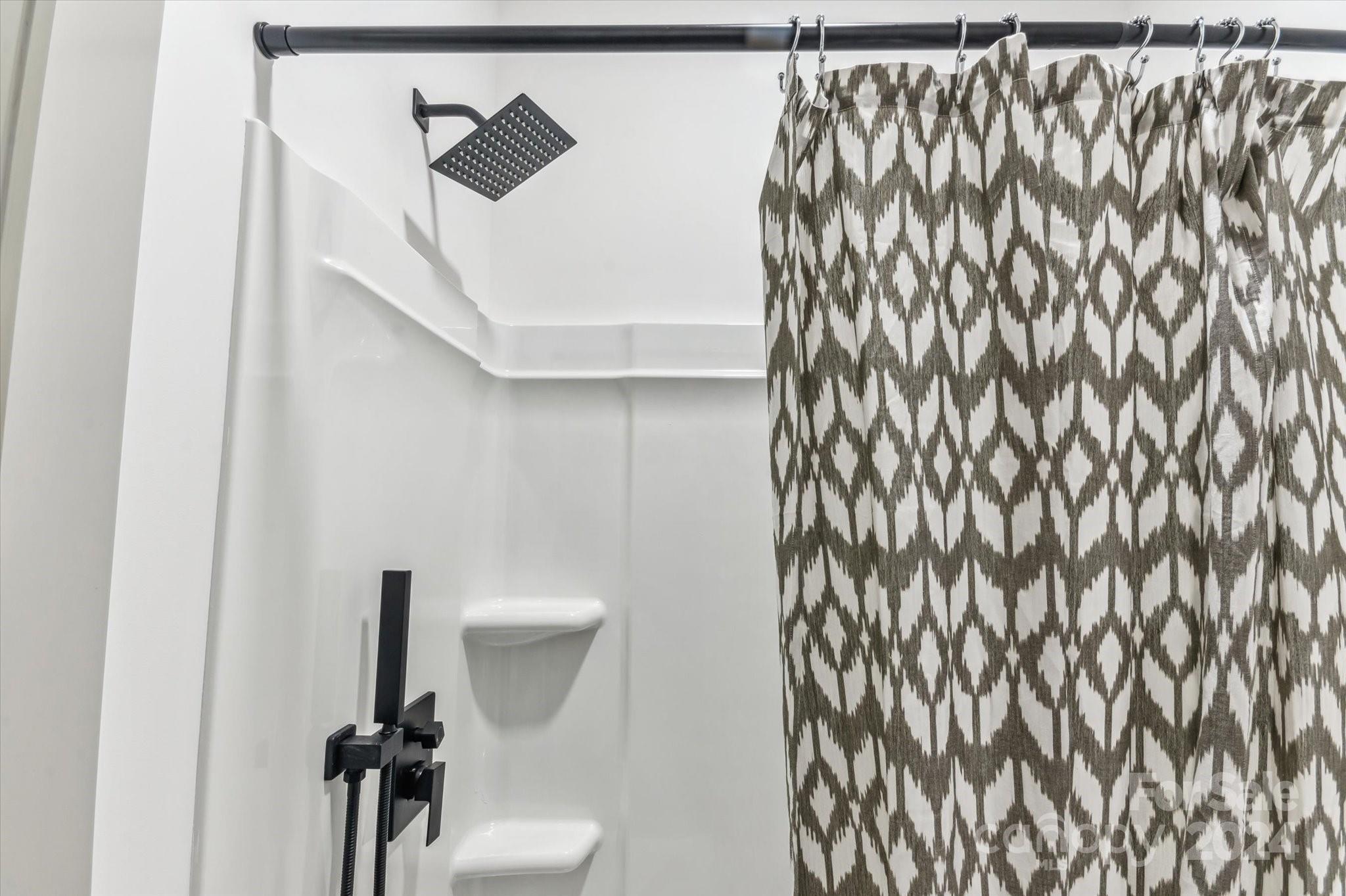 151 Laurel Loop Asheville, NC 28806 - Photo 31 of 35 a bathroom with a toilet and a shower curtain