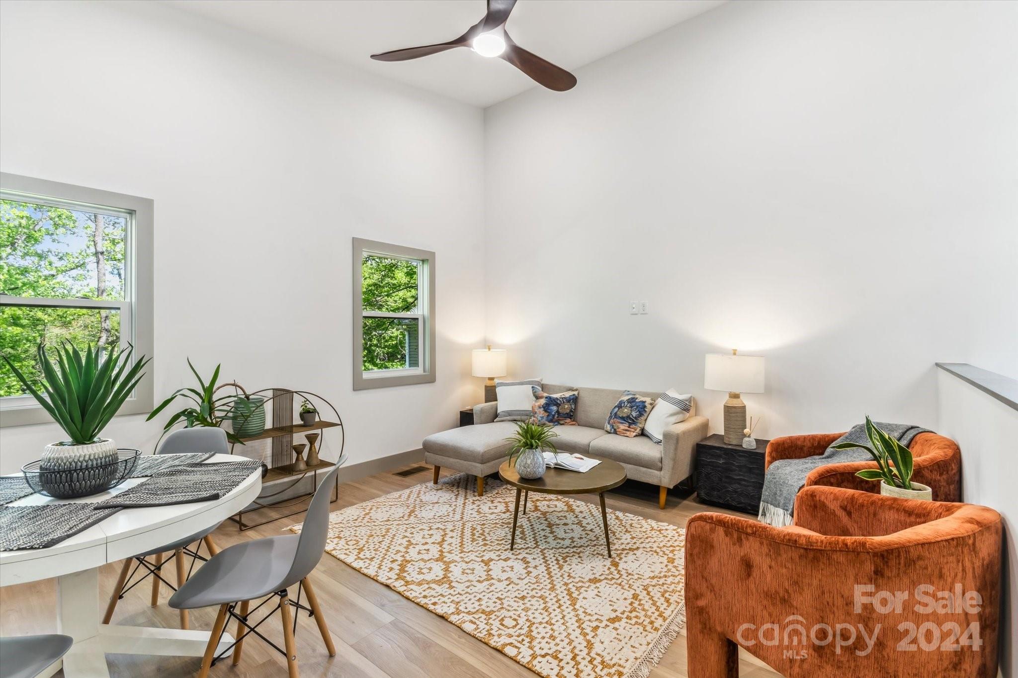 151 Laurel Loop Asheville, NC 28806 - Photo 7 of 35 a living room with furniture and a potted plant