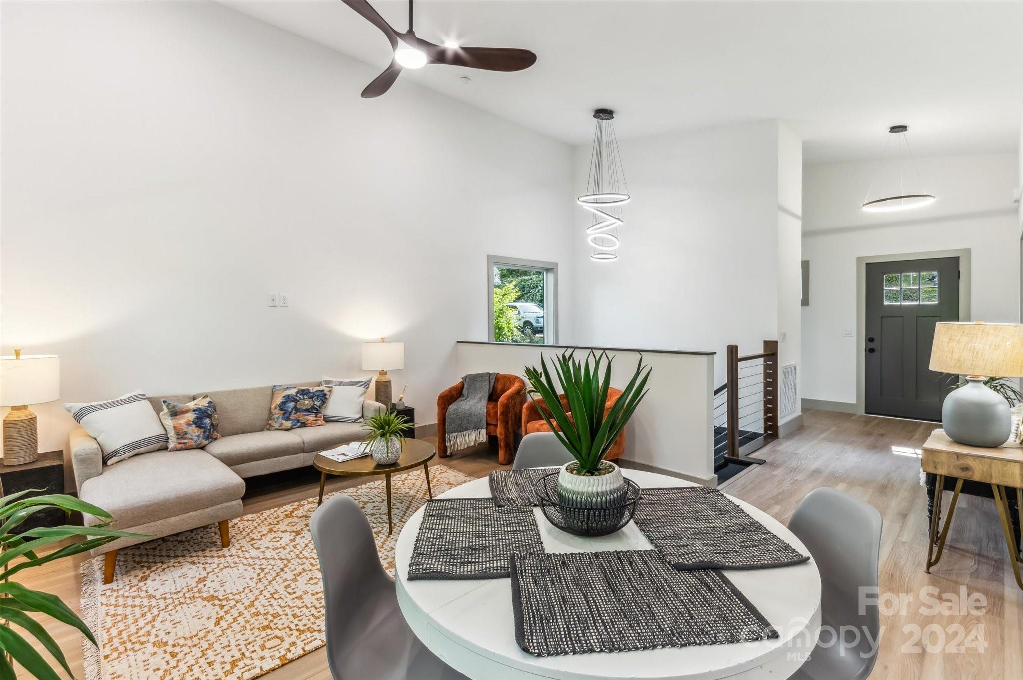 151 Laurel Loop Asheville, NC 28806 - Photo 9 of 35 a living room with furniture and wooden floor