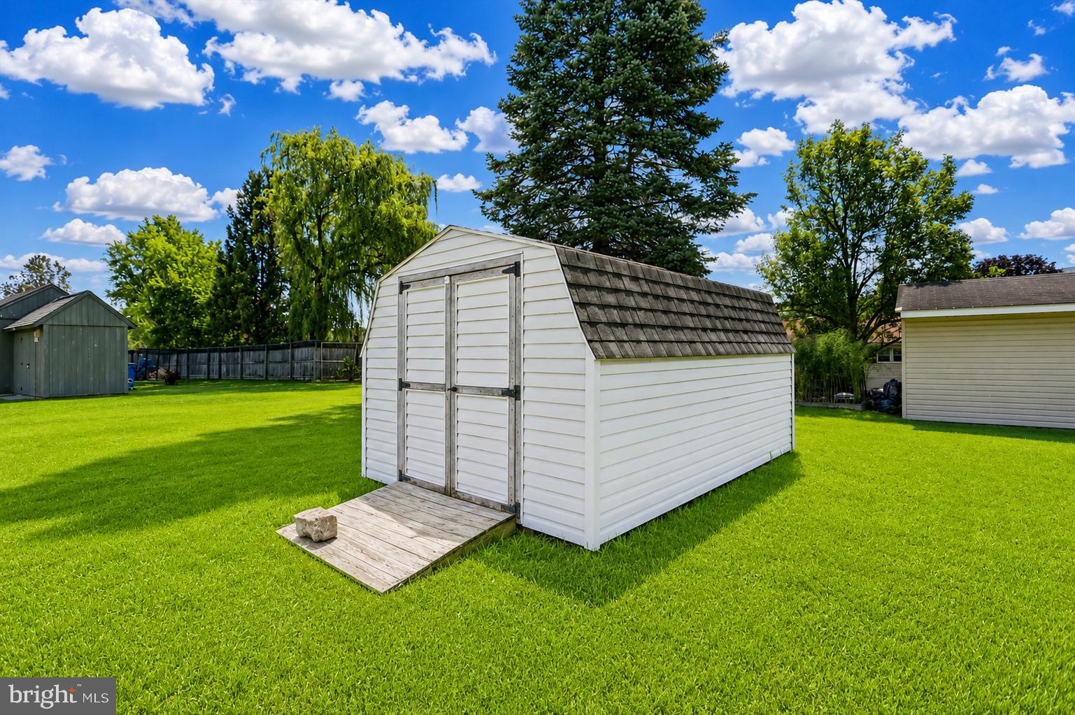 4287 Old Us-322 Reedsville, PA 17084 - Photo 32 of 33 Charming shed in a lush green yard.