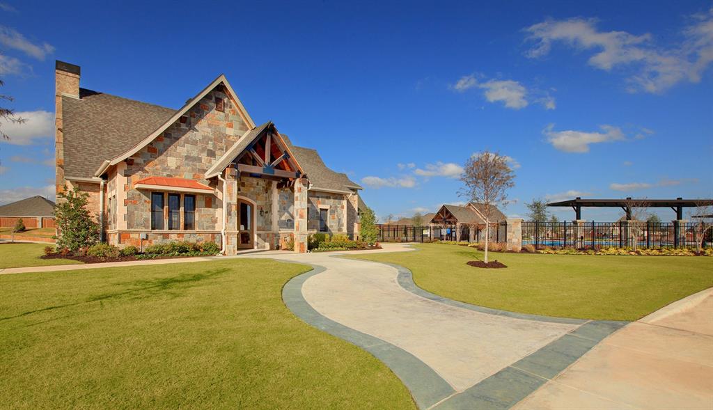 11536 Wulstone Road Fort Worth, TX 76052 - Photo 6 of 21 a view of a house with swimming pool and a yard