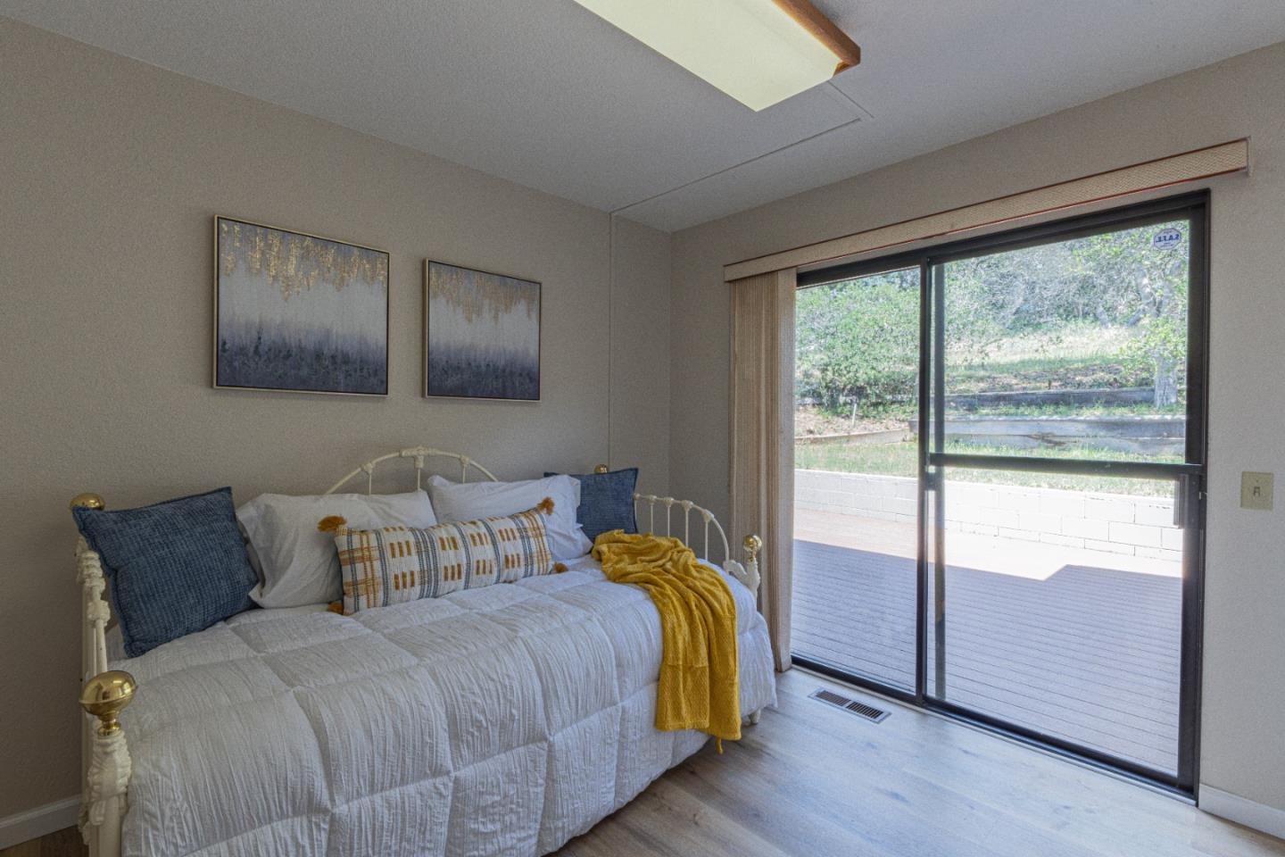 6959 Valle Pacifico Road Salinas, CA 93907 - Photo 27 of 45 a bedroom with a bed and wooden floor