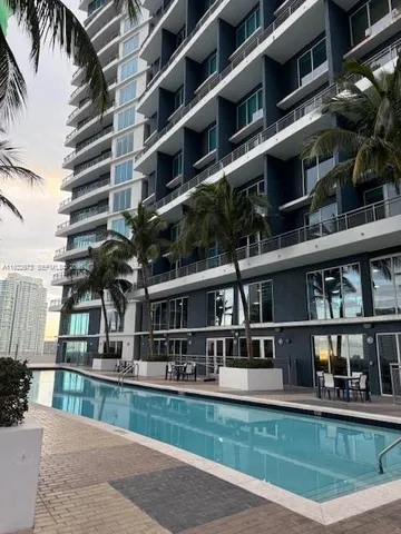 a front view of building with yard