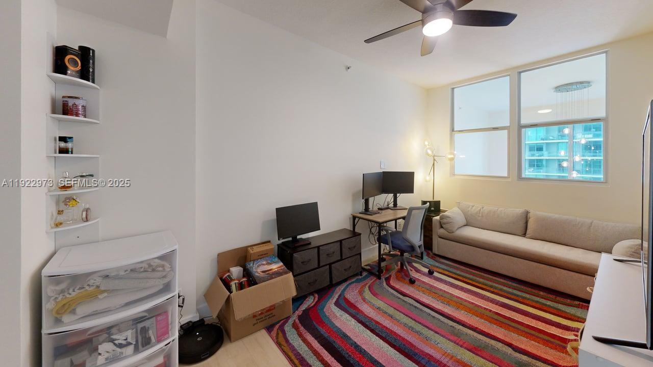 60 Southwest 13th Street, Unit 3620 Miami, FL 33130 - Photo 8 of 30 a living room with furniture and a window