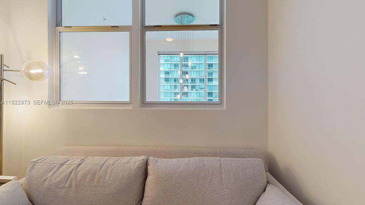 60 Southwest 13th Street, Unit 3620 Miami, FL 33130 - Photo 9 of 30 a room with a bed and a window