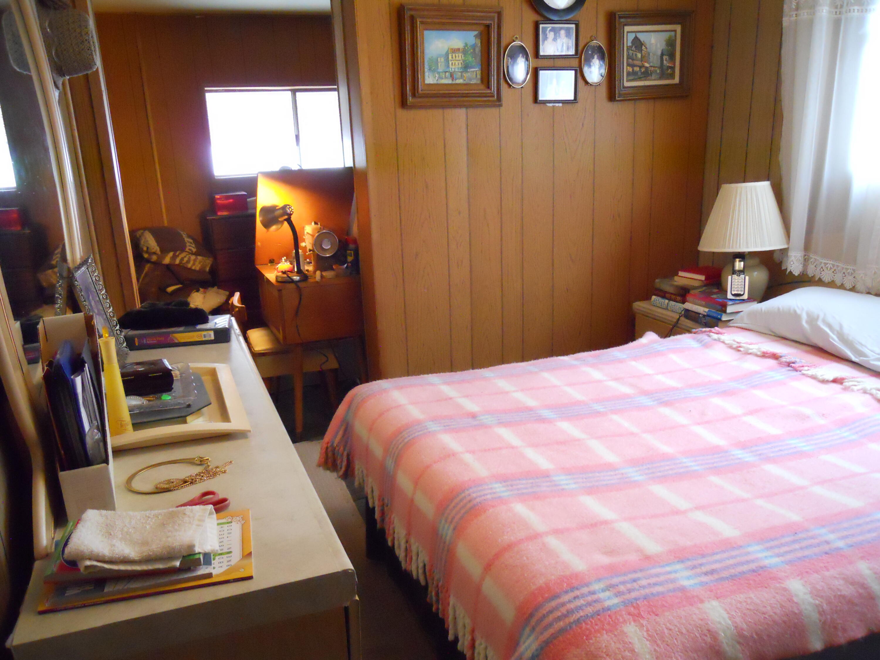 520 Pine Avenue, Unit 33 Goleta, CA 93117 - Photo 11 of 16 a bedroom with a bed and a flat tv screen on the dresser